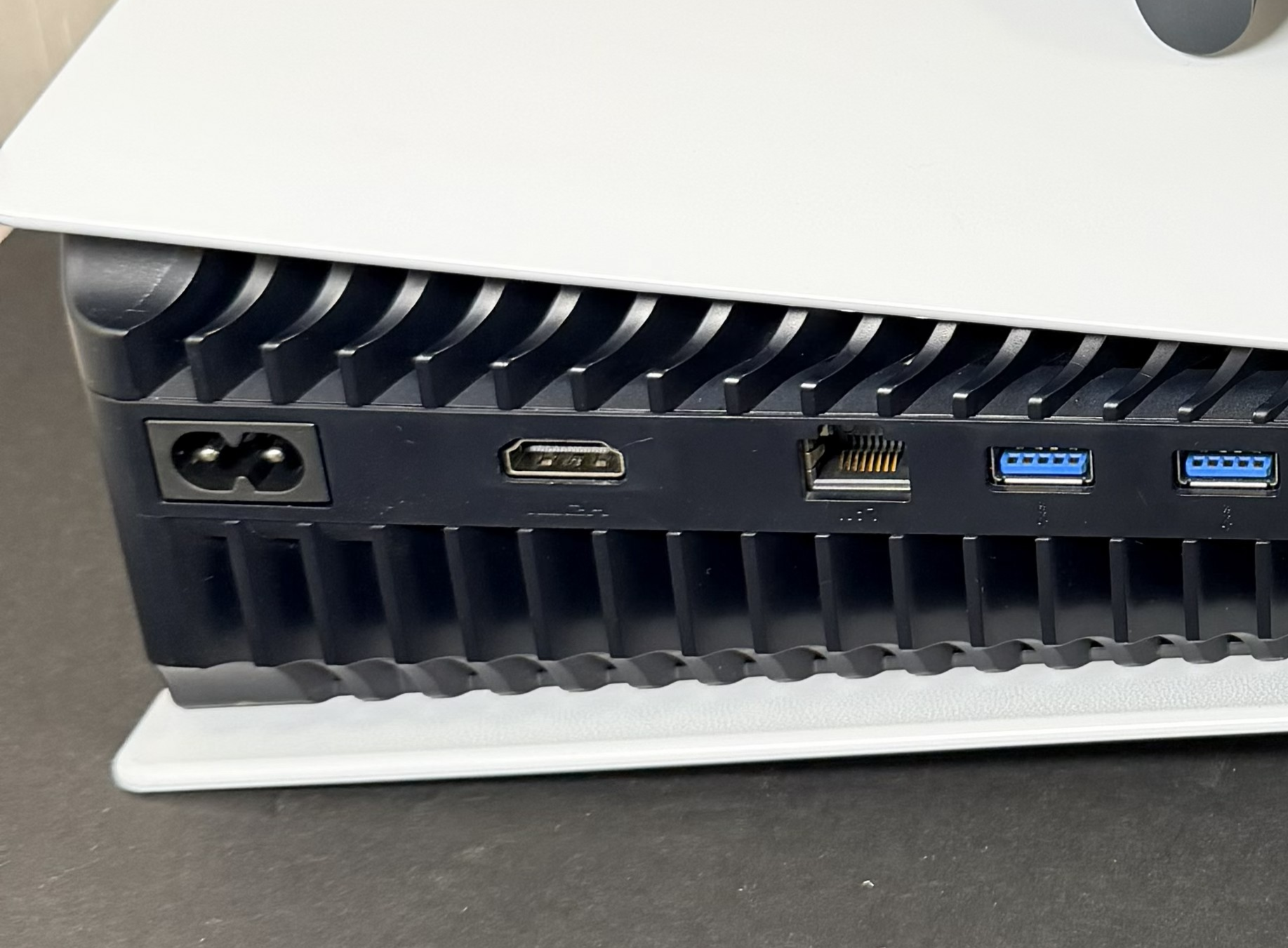 Game console HDMI repair setup with controller and gaming hardware